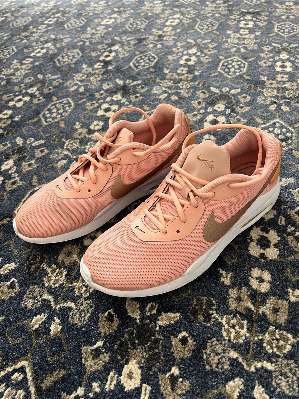Nike Women’s Coral Pink Sneakers with Gold Swoosh